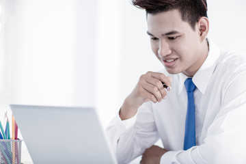 Fototapeta premium young asian businessman working in office