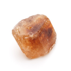 Brown caramelized lump cane sugar cube isolated on white backgro