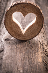 Light  heart on rustic wooden background