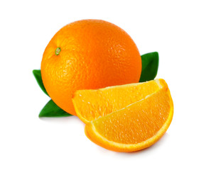 Ripe orange fruit with leaves and slices isolated on white