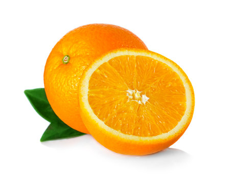 Ripe orange fruit with leaves and slices isolated on white