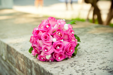 Red bouquet on gray parapet