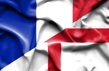 Waving flag of England and France