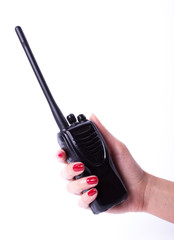 Female hand holding portable radio transmitter