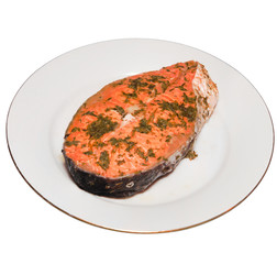 baked salmon steak on a plate is isolated white background