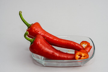sliced red peppers isolated on grey