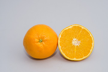 sliced orange isolated on light gray