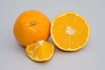 Fototapeta na wymiar sliced orange isolated on light gray