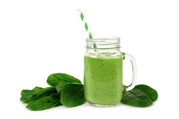 Healthy green smoothie with spinach in a jar mug isolated