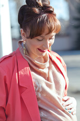 Beautiful young pregnant woman at spring outdoor