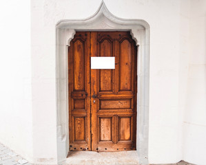 Vintage door with blank sign in Switzerland