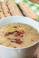 Sour soup with bread.