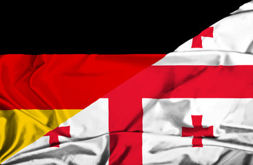 Waving flag of Georgia and Germany