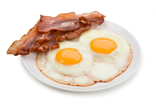 Plate With Fried Eggs, Bacon Isolated On White Background