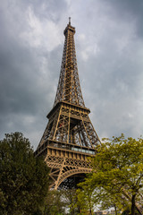 Eiffel Tower in Paris, France under a cloudy sky