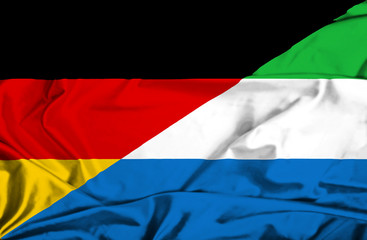 Waving flag of Sierra Leone and Germany