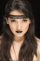 beautiful young woman wearing goth makeup