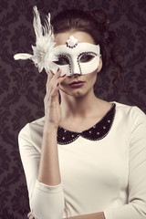 old fashion style woman in white carnival mask