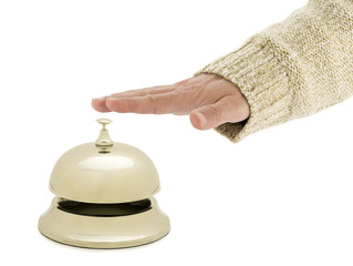 of a man ringing hotel bell isolated on white
