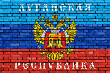 flag of Lugansk Peoples Republic painted on brick wall