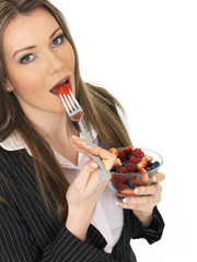 Young Business Woman Holding a Bowl of Fresh Mixed Berries