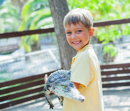 Boy with crocodile.