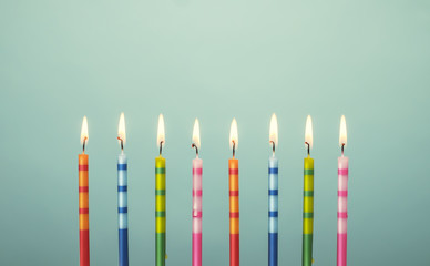 Colorful birthday cake candles - 77774765