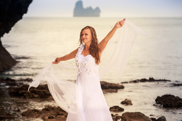 Fototapeta na wymiar bride whirls on sandy beach