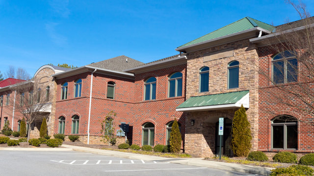 Red Brick Commercial Buildings Row With Office Space