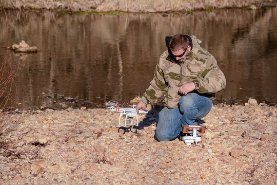 Man preparing to fly quadracopter