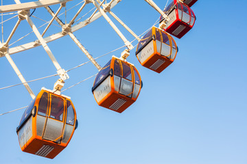 Ferris wheel against the blue sky