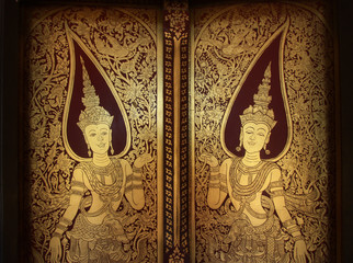 Golden door of Phumipararam temple in Chiangrai, Thailand