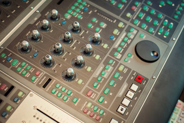 Professional mixing console in studio