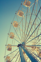 Ferris wheel against the blue sky