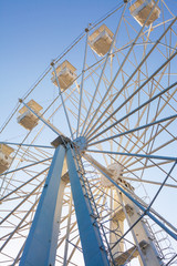 Ferris wheel against the blue sky