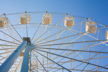 Fototapeta premium Ferris wheel against the blue sky