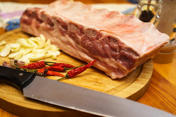 Fresh pork ribs, meat marinated and prepared for roast