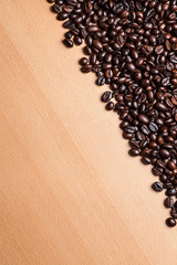 Coffee beans on wood background