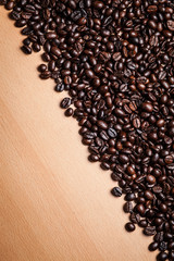 Coffee beans on wood background