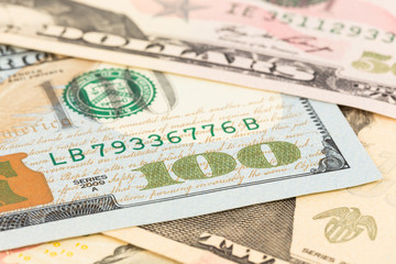 Obraz na płótnie Canvas US banknote focus on 100 dollar bill