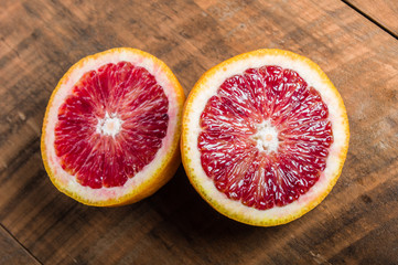 Blood orange halves on table