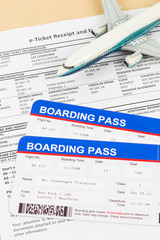 E-ticket with plane model, and boarding pass