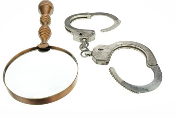 Retro Magnifying Glass and Handcuffs