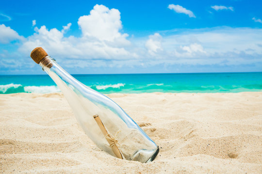 Bottle with a message on a shore