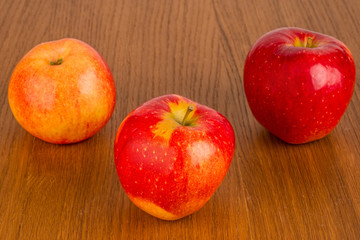 red apples on wooden table