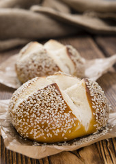 Pretzel Rolls on rustic wooden background