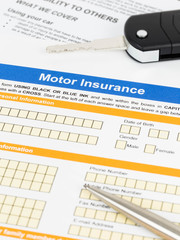 Motor or car insurance application with pen and car key