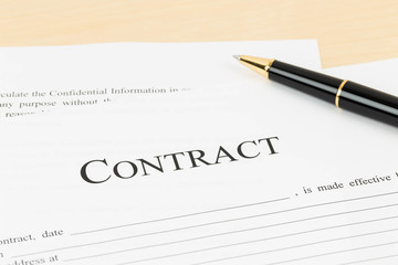 Business contract document with pen