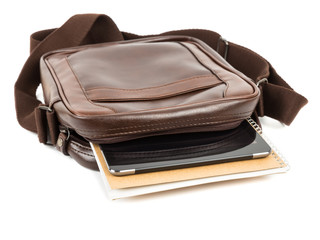 Brown messenger bag with notebook, and tablet
