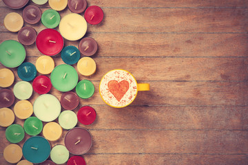 Cup and candles on a talbe